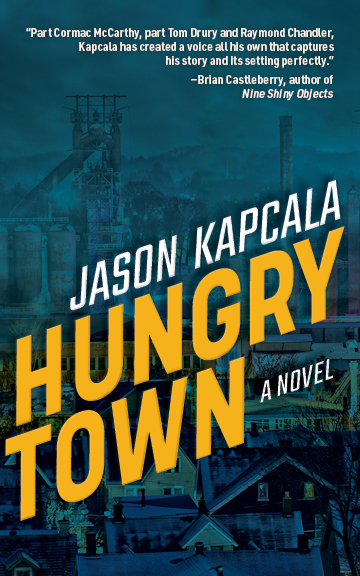 Hungry Town cover: title and author name in yellow and white letters with a blue tinted photograph of a factory town in the background